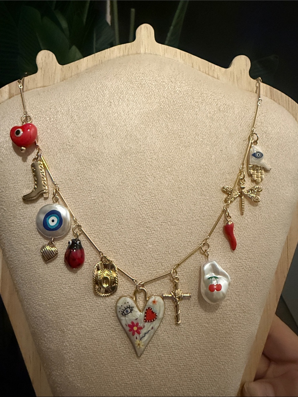 Gold Charm Necklace with Red Accents and Evil Eye Pendant